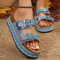 Detailed view of blue ethnic platform sandals with rhinestones and double buckle straps. - 36 / Light Blue
