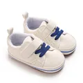 Close-up of white infant walker shoes with blue laces and soft non-slip soles - Bottom Length 11CM / White