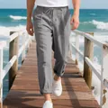 Detailed look at men's loose gray linen straight-leg trousers on a summer pier - S / Bottoms / Gray