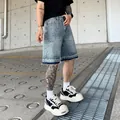 Pantaloncini di jeans larghi da uomo con lussuoso motivo a fuochi d'artificio in strass - Taglia S / Pantaloni e gonne / Azzurro
