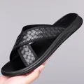 Black men's summer slides featuring stylish cross-over woven straps and non-slip sole. - 38 / Black