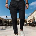 Close-up of men's black slim fit business casual trousers showing fabric elasticity and fit - S / Bottoms / Black
