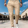 Detail of men's slim fit stretch business casual trousers in khaki with elastic waist - S / Bottoms / Light Khaki