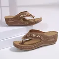 Wedge flip-flop sandals in tan with stylish metal chain and rhinestone detail - Tan