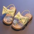Yellow girls' princess sandals featuring a large bow and shiny rhinestone flower detail - Yellow