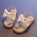 Elegant pink girls sandals featuring a large soft bow and sparkling rhinestone flower - Pink