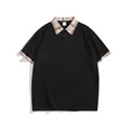 Men's casual black short sleeve polo shirt featuring classic plaid collar and cuffs - S / Tops / Black