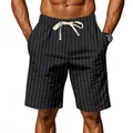 Close-up detail of men's black pinstripe linen shorts featuring a white drawstring waist - S / Bottoms / Black