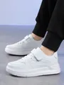 Detailed view of white kids' sneakers with hook and loop closure for school boys - 38 / All White