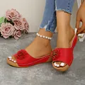 Elegant women's red floral wedge slides featuring breathable laser-cut hole details - Red