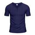 Close-up of navy blue men's Henley shirt with waffle texture and two-button collar - S / Tops / Navy Blue