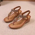 Sandales compensées marron style bohème avec lanières perlées et motifs papillons - 36 / Bronze