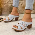 Light blue platform high-heel mule sandals featuring laser-cut patterns and decorative buckle - Blue