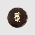 Premium brown enamel glaze button featuring a gold Gothic emblem for luxury apparel - Gold + Brown