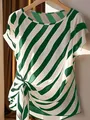 Elegant green and white diagonal striped women's top featuring a stylish front knot detail. - Green