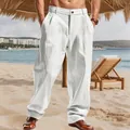 Full-length view of white linen-style men's loose straight casual trousers on beach - White