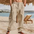 Detail of men's loose beige linen trousers perfect for a casual summer beach outfit. - Light Khaki