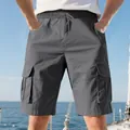 Men's grey multi-pocket cargo shorts shown in a nautical leisure lifestyle setting - Dark Gray