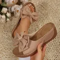 Elegant women's platform wedge sandals with a large decorative bow detail in beige. - Brown