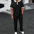 Close-up view of men's black summer jacquard polo shirt and matching trousers casual sports set - S / Top And Bottom / Black