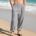 Detail view of men's grey linen jogger pants with elastic cuffs and drawstring waist - S / Bottoms / Gray