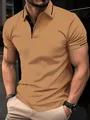 Close-up detail of a slim fit men's tan polo shirt featuring black contrast collar trim - S / Tops / Yellow