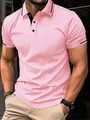 Close-up of pink jacquard polo shirt with black trim details on collar and sleeves - S / Tops / Pink