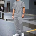 Macro view of grey textured jacquard fabric on a men's casual two-piece summer set - S / Top And Bottom / Gray