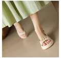 Detailed view of minimalist thick-soled women's peep-toe sandals in stylish beige - Beige