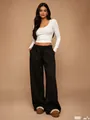 Full body view of women's black wide-leg sweatpants with a cozy elastic drawstring waist - XS / Bottoms / Black