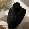 Elegante collana minimalista a doppio strato con catena a serpente dorata e finitura lucida - Collana a Catena a Serpente a Doppio Strato Minimalista (X860-16) / Oro