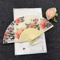 Traditional Chinese folding fan with elegant peony floral pattern and white silk tassel - National Beauty - Light Handle
