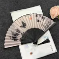 Traditional Chinese style folding fan with butterfly and bamboo ink wash patterns and tassel - Butterfly - Black Handle