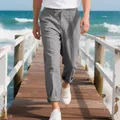 Macro view showing the breathable linen fabric and relaxed fit of these grey men's beach trousers. - S / Bottoms / Gray