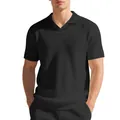 Vue détaillée d'un polo noir en maille gaufrée avec un col Burke minimaliste. - S / Hauts / Noir