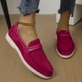 Detail view of fuchsia suede-like slip-on loafers with flat white soles and gold anklet - Burgundy