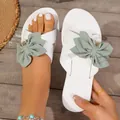 Detail of white summer slide with large green fabric bow and pearl embellishment - 36 / White Green