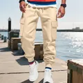 Close-up of men's heavy khaki cargo pants featuring functional multi-pocket design - S / Bottoms / Khaki
