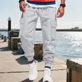 Detailed shot of men's heavyweight grey cargo pants with side pockets and striped cuffs - S / Bottoms / Light Gray