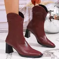 Detailed view of burgundy leather pointed toe ankle boots with a chunky high heel - 35 / Red