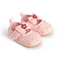 Close-up detail of pink embroidered baby girl walking shoes with a decorative bow - 11cm / Pink