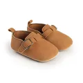 Close-up detail of brown suede baby shoes with retro buckle and soft flat sole design - Insole Length 11cm / Tan