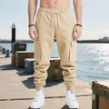 Close-up of beige heavyweight cargo pants for men featuring a relaxed high street fit - Khaki