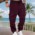 Vista dettagliata dei pantaloni cargo bordeaux da uomo con tasche laterali e coulisse - Taglia S / Pantaloni e gonne / Rosso ciliegia