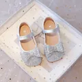 Elegant silver glitter girl's princess shoes featuring a large rhinestone bow detail - Silver