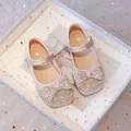 Elegant champagne pink girls' Mary Jane shoes featuring a large glittery rhinestone bow - Pink