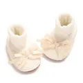 Detailed view of cream baby lace socks featuring a silk bow and anti-slip soft sole. - Beige
