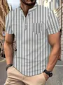 Detailed view of a men's grey and white vertical striped polo shirt with chest pocket. - S / Tops / Light Gray