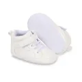 Detailed view of white high-top baby walking shoes featuring non-slip dotted soft soles - White