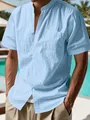 Detail view of light blue linen-textured short sleeve shirt with a stand collar design - S / Tops / Sky Blue